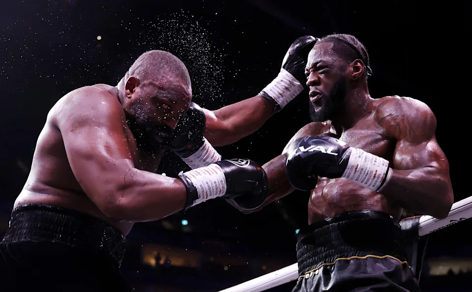 LONDON, ENGLAND - APRIL 04: Deontay Wilder punches Derek Chisora during the Heavyweight fight between Derek Chisora and Deontay Wilder as part of the Dereck Chisora v Deontay Wilder: 100 fight night at The O2 Arena on April 04, 2026 in London, England. (Photo by Richard Pelham/Getty Images)