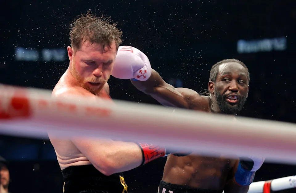 Terence Crawford beat Canelo Alvarez (right) on points to become a three-weight undisputed champion (Getty)