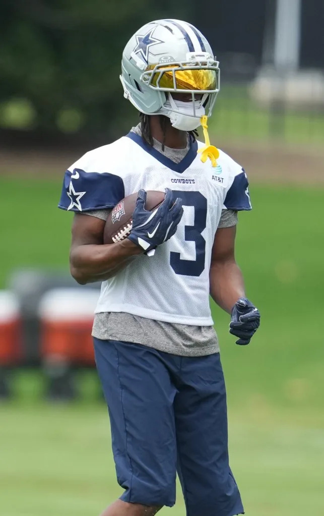 Cowboys receiver George Pickens holds a ball during practice. Chris Jones-Imagn Images