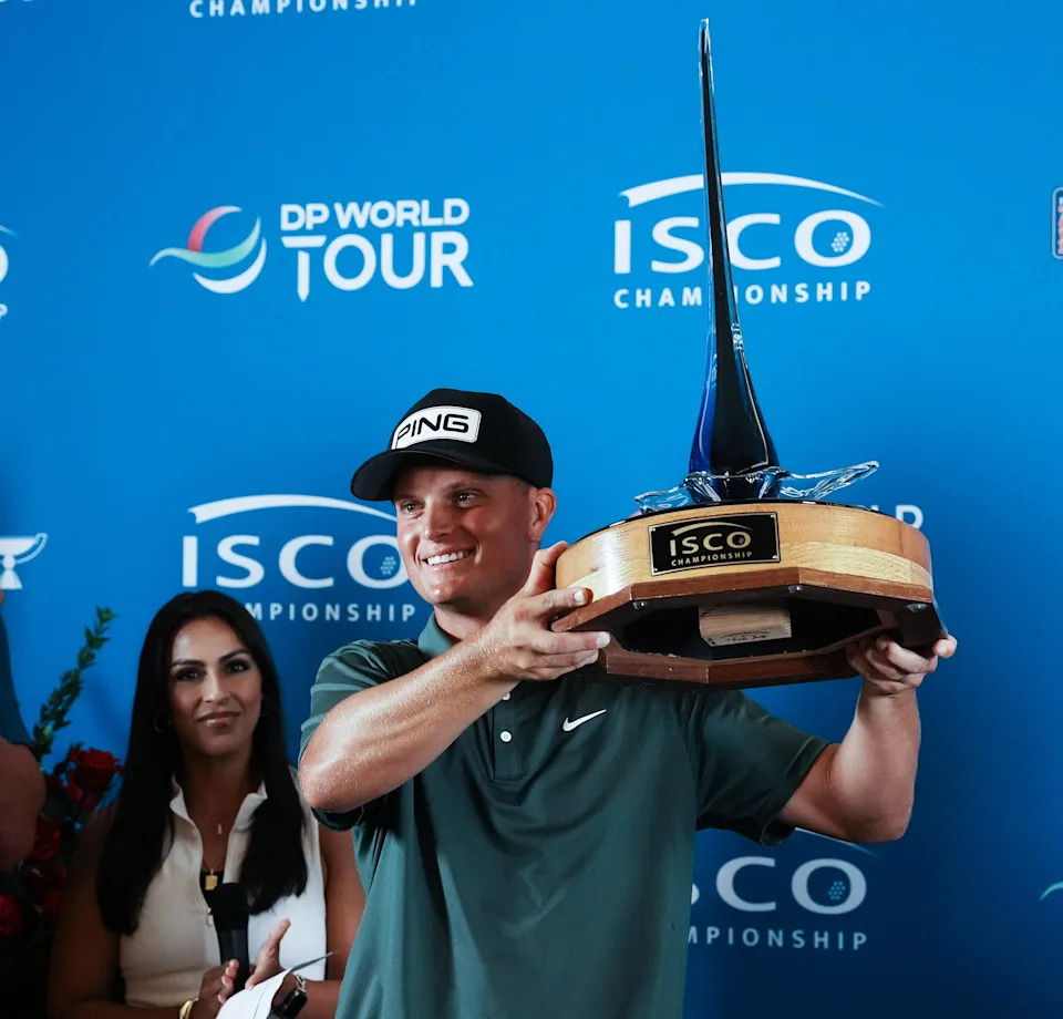 William Mouw hoisted the winning trophy after he shot a 9 under 61 during the fourth round to win the ISCO Championship golf tournament at the Hurstbourne Country Club in Louisville, Ky. on July 13, 2025. He finished at 10 under par for the tournment.