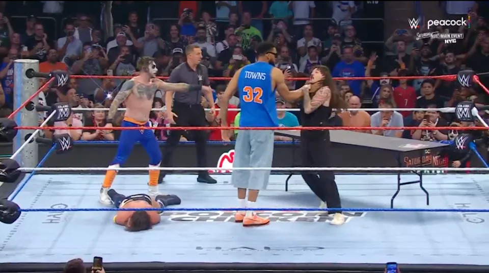 Towns chokeslammed Dominik Mysterio through a wooden table. WWE on X