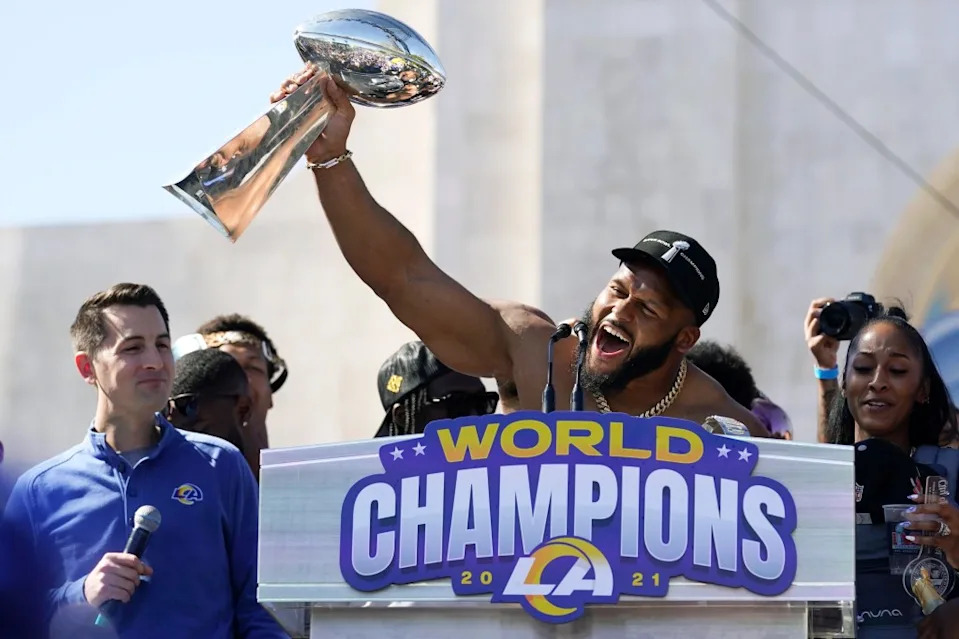 Donald holds up the Vince Lombardi Trophy during the Rams’ victory celebration and parade in <a class="link " href="https://sports.yahoo.com/nfl/teams/la-rams/" data-i13n="sec:content-canvas;subsec:anchor_text;elm:context_link" data-ylk="slk:Los Angeles;sec:content-canvas;subsec:anchor_text;elm:context_link;itc:0" data-yga="{"yLinkElement":"context_link","yModuleName":"content-canvas","yLinkText":"Los Angeles","ySubModuleName":"anchor_text","yHasCommerce":false}">Los Angeles</a>. AP