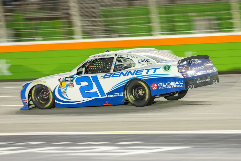 Jul 11, 2026; Hampton, Georgia, USA; Bennett Transportation driver Austin Hill (21) races at the Focused Health 250 at EchoPark Speedway. Mandatory Credit: Jordan Godfree-Imagn Images