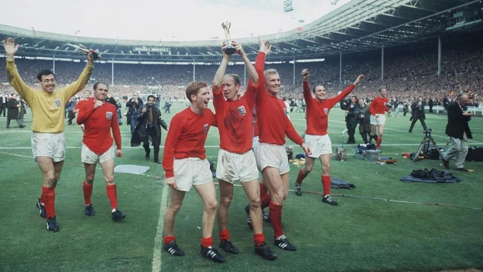 England players celebrate on the Wembley pitch in 1966