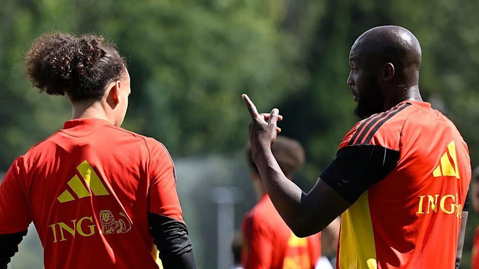 Romelu Lukaku gives instructions to team-mate Arthur Theate during a Belgium training session at the 2026 World Cup