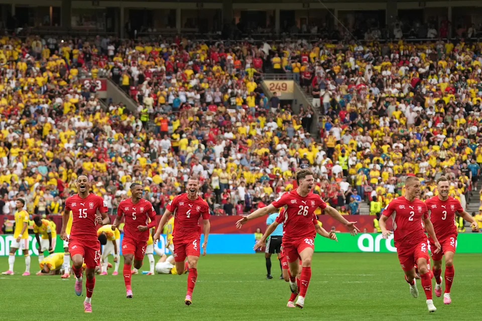 Swiss players celebrate after winning the penalty shootout during the World Cup round of 16 soccer match between Switzerland and Colombia in Vancouver, British Columbia, Tuesday, July 7, 2026. (AP Photo/Abbie Parr)