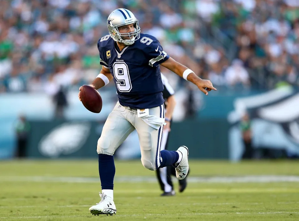 Tony Romo runs with the ball. Getty Images