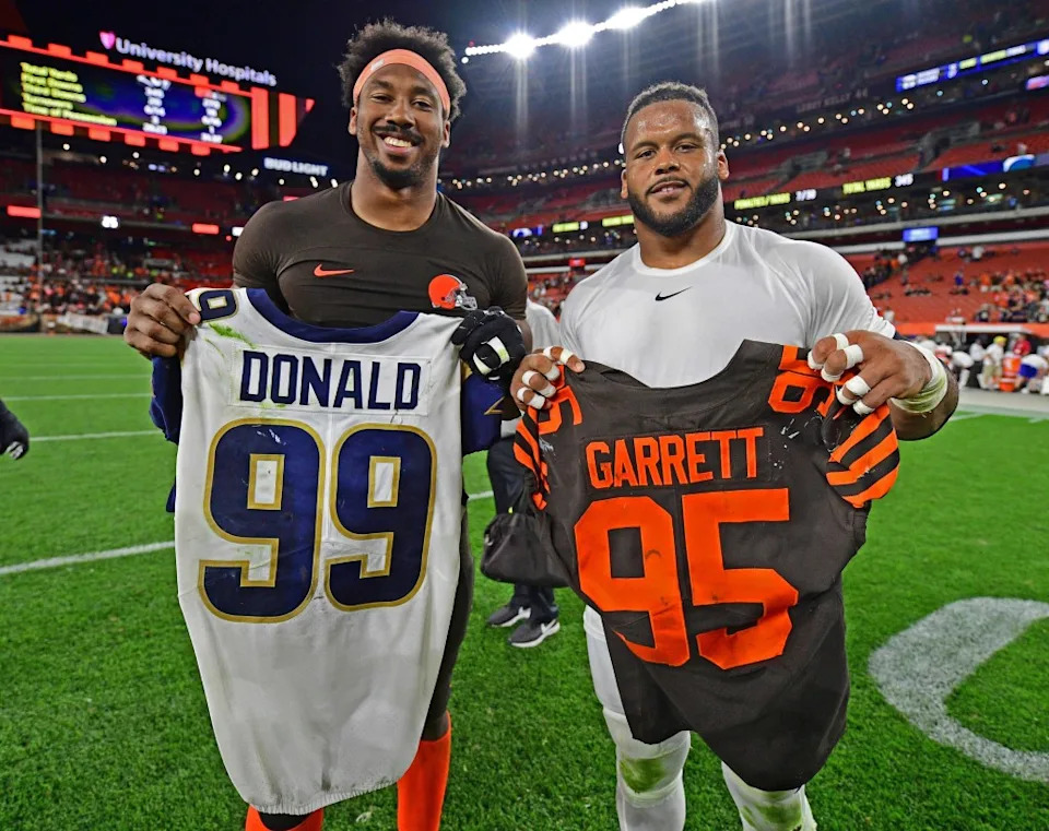Former Browns defensive end Myles Garrett (left) would love to play on the same line as Donald. AP