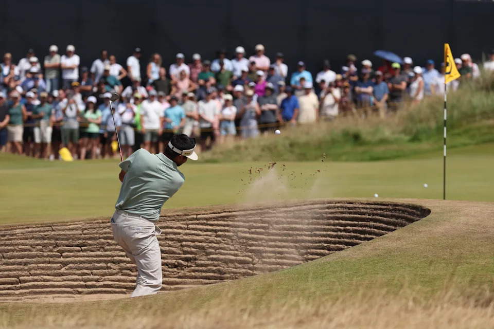 Jason Day plays a shot from a bunker on the 13th hole during the first round of The Open Championship 2026 at Royal Birkdale.