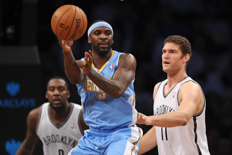 Ty Lawson #3 of the <a class="link " href="https://sports.yahoo.com/nba/teams/denver/" data-i13n="sec:content-canvas;subsec:anchor_text;elm:context_link" data-ylk="slk:Denver Nuggets;sec:content-canvas;subsec:anchor_text;elm:context_link;itc:0" data-yga="{"yLinkElement":"context_link","yModuleName":"content-canvas","yLinkText":"Denver Nuggets","ySubModuleName":"anchor_text","yHasCommerce":false}">Denver Nuggets</a> looks for a pass with pressure from <a class="link " href="https://sports.yahoo.com/nba/players/4472/" data-i13n="sec:content-canvas;subsec:anchor_text;elm:context_link" data-ylk="slk:Brook Lopez;sec:content-canvas;subsec:anchor_text;elm:context_link;itc:0" data-yga="{"yLinkElement":"context_link","yModuleName":"content-canvas","yLinkText":"Brook Lopez","ySubModuleName":"anchor_text","yHasCommerce":false}">Brook Lopez</a> #11 of the <a class="link " href="https://sports.yahoo.com/nba/teams/brooklyn/" data-i13n="sec:content-canvas;subsec:anchor_text;elm:context_link" data-ylk="slk:Brooklyn Nets;sec:content-canvas;subsec:anchor_text;elm:context_link;itc:0" data-yga="{"yLinkElement":"context_link","yModuleName":"content-canvas","yLinkText":"Brooklyn Nets","ySubModuleName":"anchor_text","yHasCommerce":false}">Brooklyn Nets</a> during the second half at Barclays Center on December 3, 2013. Getty Images