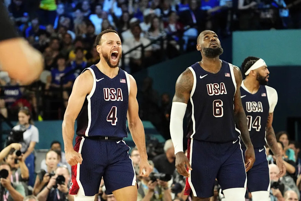 Stephen Curry (4) and LeBron James (6) of Team USA react in the second half against France in the men's basketball gold medal game on Aug. 10, 2024. 