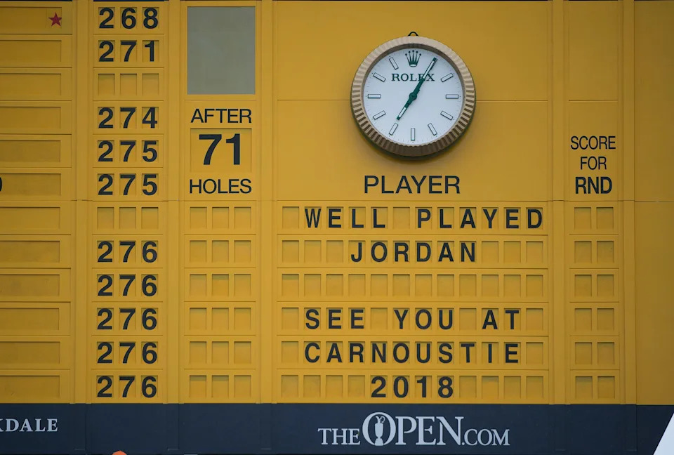 Jordan Spieth is congratulated for his victory at the 2017 Open on the famed yellow leaderboard at 18.