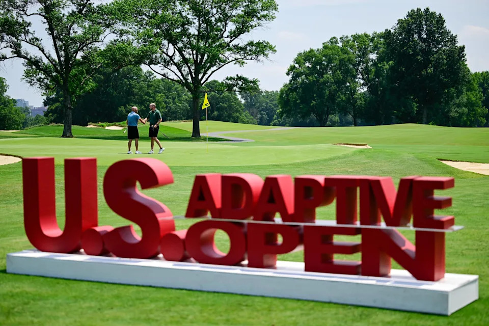 Jonathan Chown and Joshua Philbeck interact on the ninth hole after sinking their putts during a practice round ahead of the 2026 U.S. Adaptive Open at Woodmont Country Club (South Course) in Rockville, Md. on Sunday, July 5, 2026. (Logan Whitton/USGA)