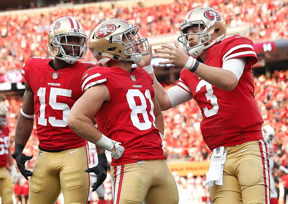 San Francisco 49ers wide receiver Trent Taylor (81) is congratulated by wide receiver <a class="link " href="https://sports.yahoo.com/nfl/players/8982/" data-i13n="sec:content-canvas;subsec:anchor_text;elm:context_link" data-ylk="slk:Pierre Garcon;sec:content-canvas;subsec:anchor_text;elm:context_link;itc:0" data-yga="{"yLinkElement":"context_link","yModuleName":"content-canvas","yLinkText":"Pierre Garcon","ySubModuleName":"anchor_text","yHasCommerce":false}">Pierre Garcon</a> (15) and quarterback <a class="link " href="https://sports.yahoo.com/nfl/players/30217/" data-i13n="sec:content-canvas;subsec:anchor_text;elm:context_link" data-ylk="slk:C.J. Beathard;sec:content-canvas;subsec:anchor_text;elm:context_link;itc:0" data-yga="{"yLinkElement":"context_link","yModuleName":"content-canvas","yLinkText":"C.J. Beathard","ySubModuleName":"anchor_text","yHasCommerce":false}">C.J. Beathard</a> (3) AP