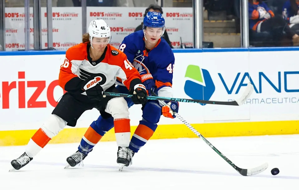 Philadelphia Flyers center Trevor Zegras (46) and New York Islanders defenseman Matthew Schaefer (48) battle for the puck. Noah K. Murray for NY Post