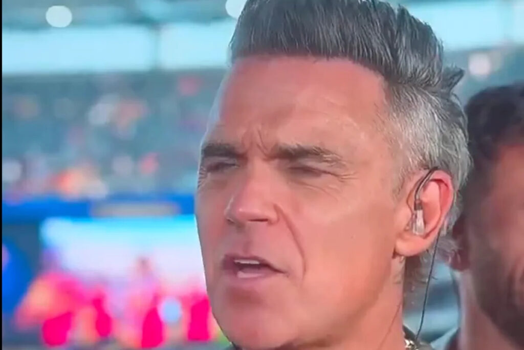 Robbie Williams addresses World Cup final TV incident after white object falls from mouth Robbie Williams addresses World Cup final TV incident after white object falls from mouth