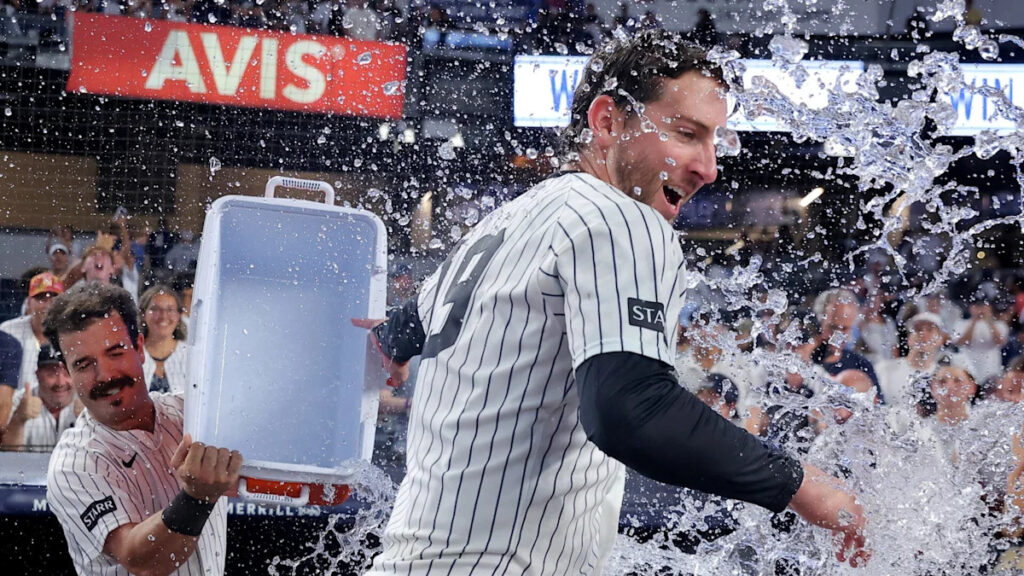 Yankees rally with 2 outs in 9th inning and beat Braves 3-2 in 10 after long rain delay
