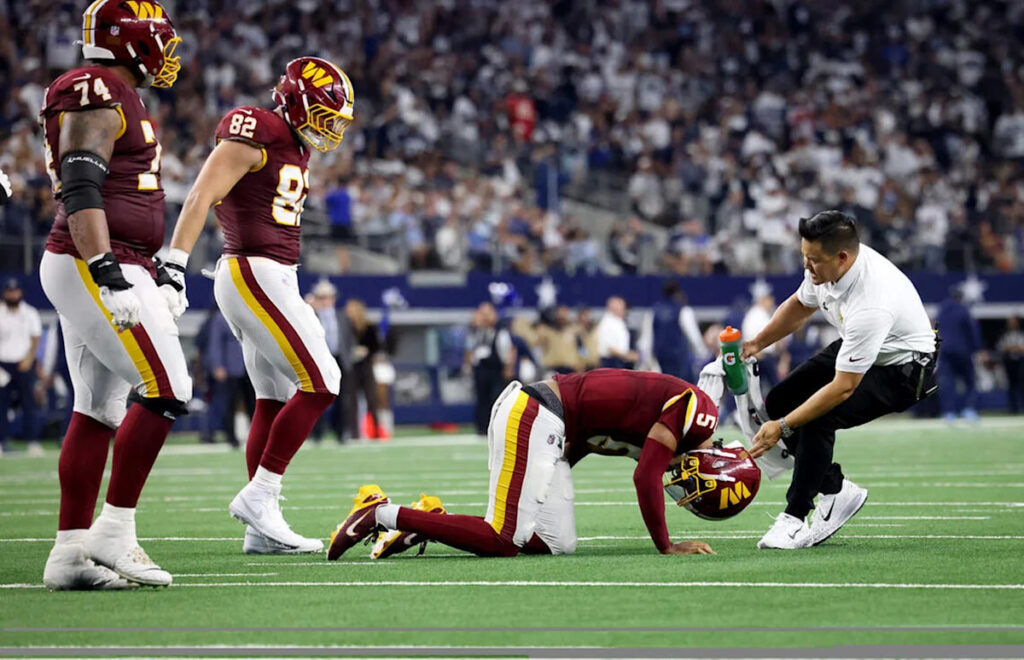 Jayden Daniels to visit with specialists after sustaining dislocated elbow in loss to Cowboys