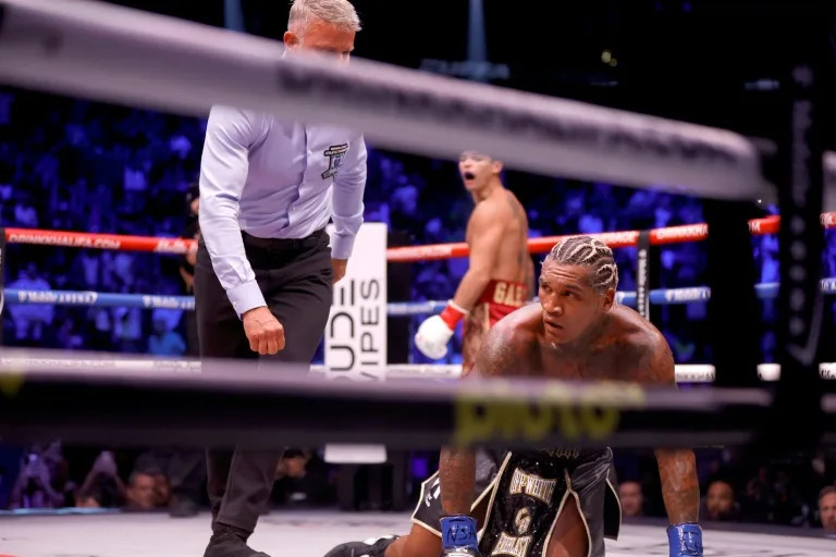Garcia keeps WBC welterweight title by stopping Benn Garcia keeps WBC welterweight title by stopping Benn