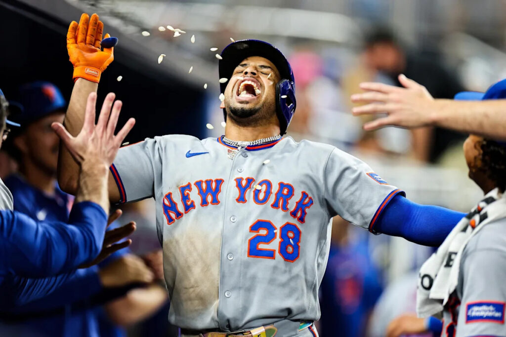 Mets offense outlasts Marlins in marathon win