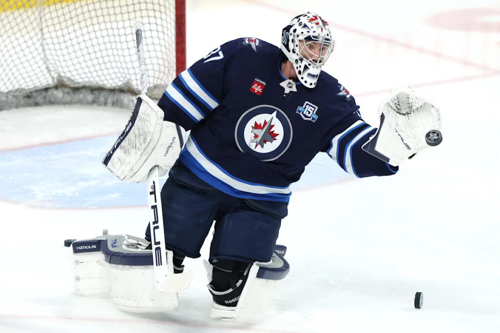 Jets’ Connor Hellebuyck suspended for not reporting to training camp amid trade request